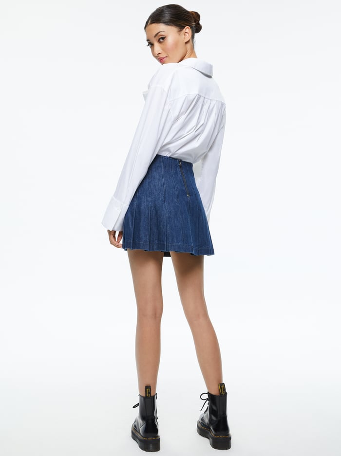 CARTER PLEATED DENIM MINI SKIRT - LOVE TRAIN image 1 - Alice And Olivia